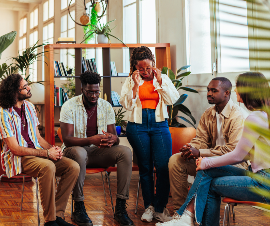 group of people listen to women talking